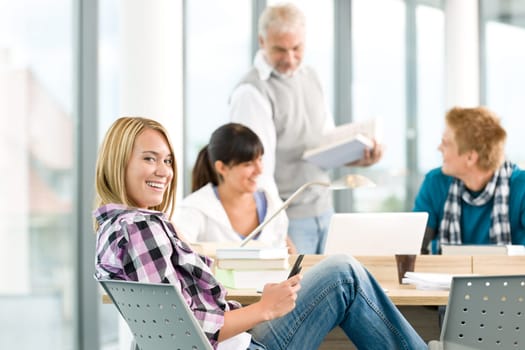 High school - three students with mature professor
