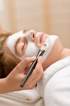 Male cosmetics - facial mask in salon