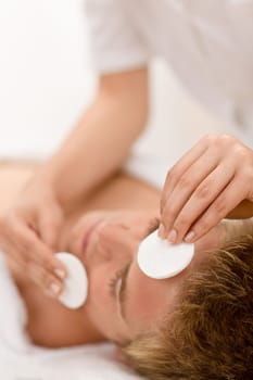 Male cosmetics - cleaning face in salon
