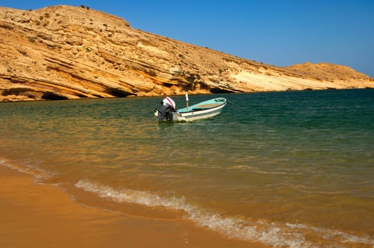 Motorboat moored in the picturesque bay on the Gulf of Oman,Sultanate of Oman
