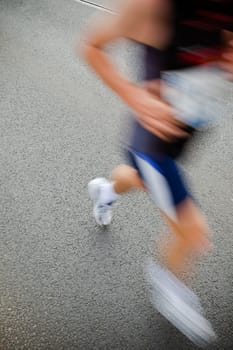 People running in city marathon