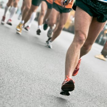People running in city marathon