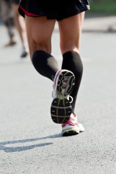 People running in city marathon