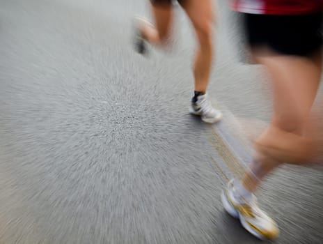 People running in city marathon