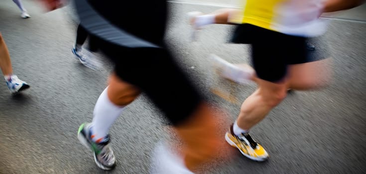 People running in city marathon