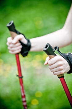 Nordic Walking - Young woman is hiking