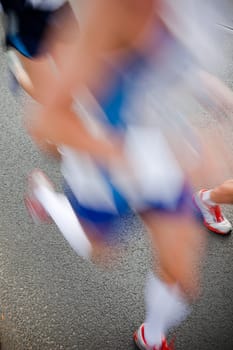 People running in city marathon