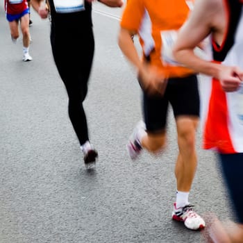 People running in city marathon