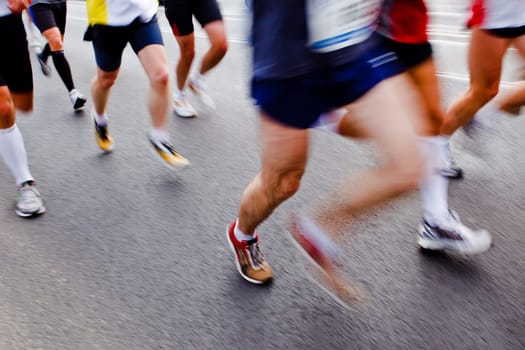 People running in city marathon