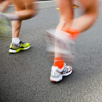 People running in city marathon