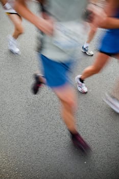 People running in city marathon