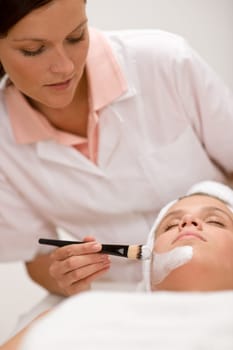 Facial mask - woman at beauty salon
