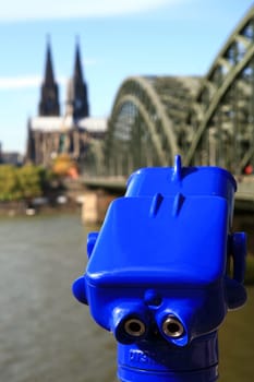 blue telescope in front of Cologne Cathedral
