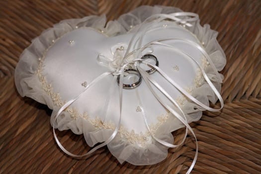 Wedding rings on velvet cushions