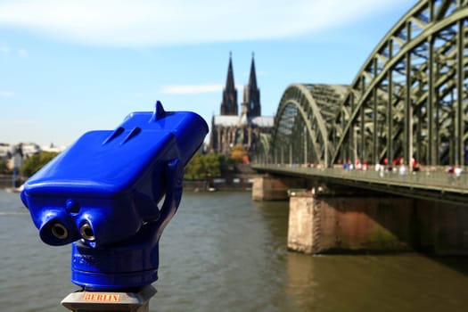 blue telescope in front of Cologne Cathedral