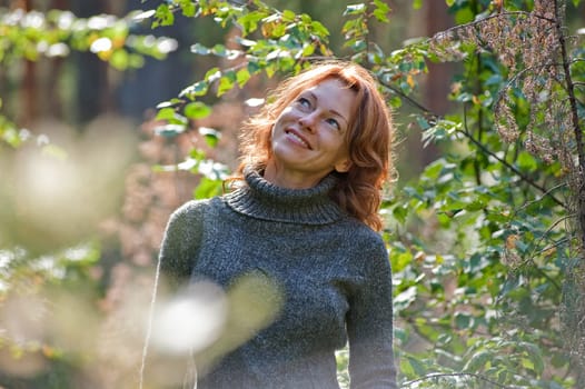 Portrait of red-haired adult women in na