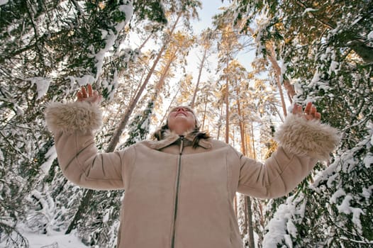 Happy middle-aged woman having fun on wi