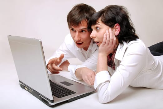 Young couple using laptop