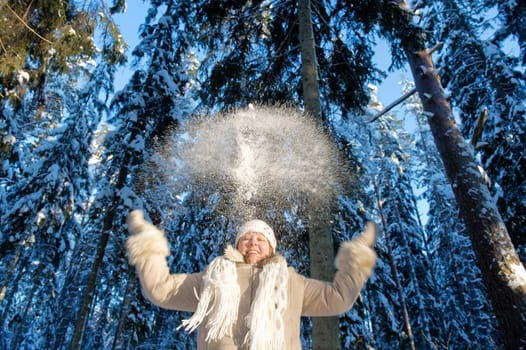 Happy middle-aged woman having fun on wi