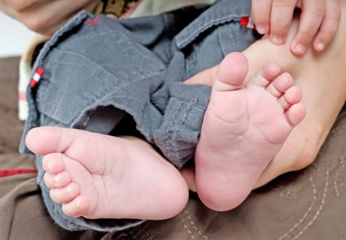 Newborn child and hands