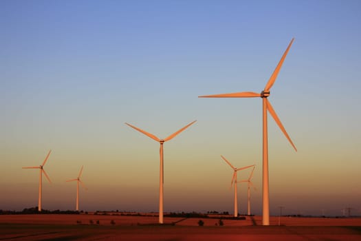 Wind turbines at sunset
