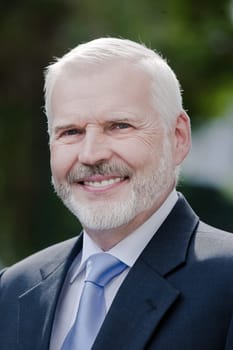 Senior businessman portrait smile friendly