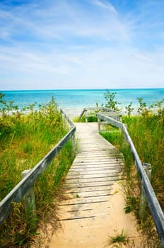 Wooden walkway over dunes at beach