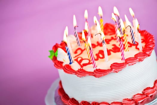 Birthday cake with lit candles