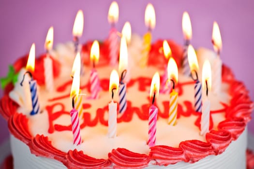 Birthday cake with lit candles