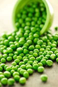 Spilled bowl of green peas