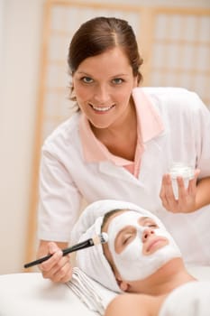 Facial mask - woman at beauty salon
