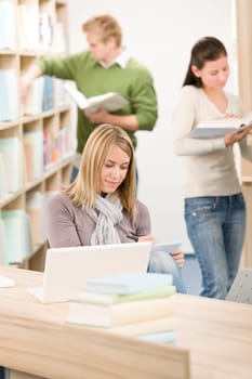 High school library - Student with laptop