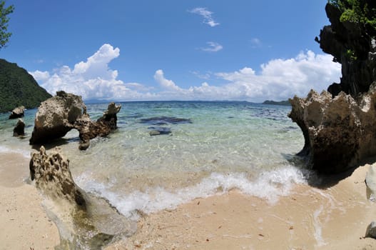 Small sandy beach in Palawan / Philippines photographed with fisheye
