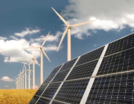 Solar cells in front of wind turbine and field