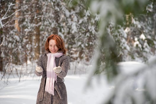 Happy red-haired woman having fun on win