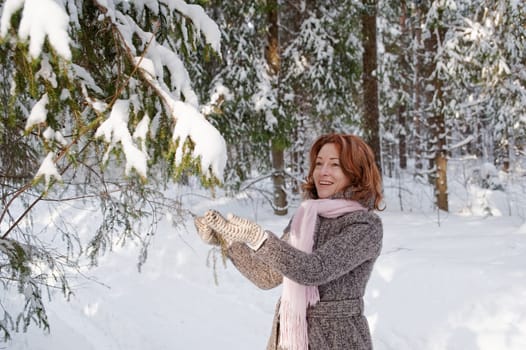 Happy red-haired woman having fun on win