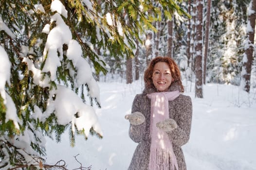 Happy red-haired woman having fun on win