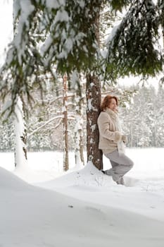 Happy red-haired woman having fun on win