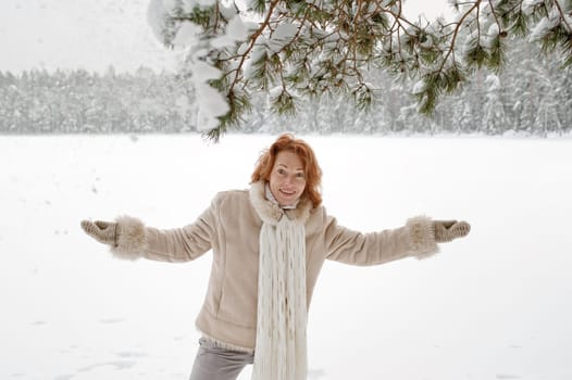 Attractive red-haired woman having fun o