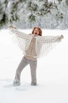 Attractive red-haired woman having fun o