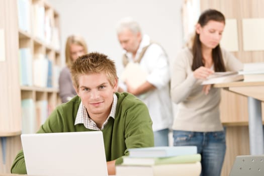 High school library - Student with book