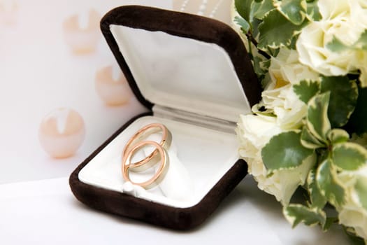 Wedding rings and bouquet