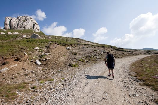 Man trekking in high mountains