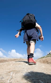 Man trekking in high mountains