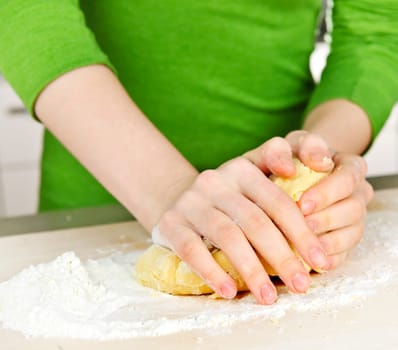 Hands kneading dough