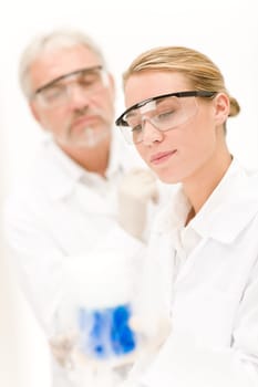 Chemistry experiment - scientists in laboratory