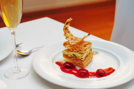 A delicious dessert with berry sauce and