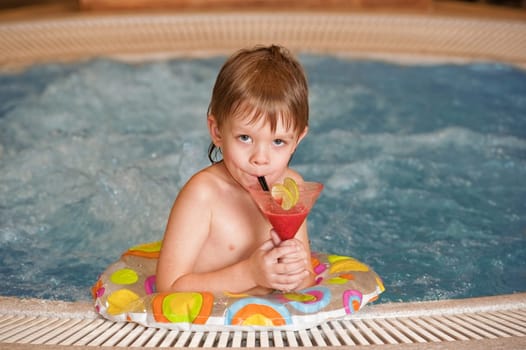 Boy with glass of coctail