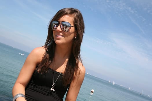 young woman by the sea