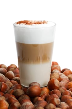 Latte macchiato between hazelnuts